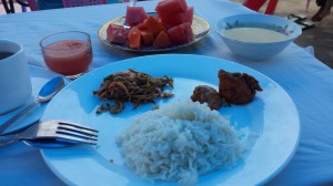 Coconut fried rice with some chicken curry, pickled veggies, soup for breakfast on Day 1 in Bagan.